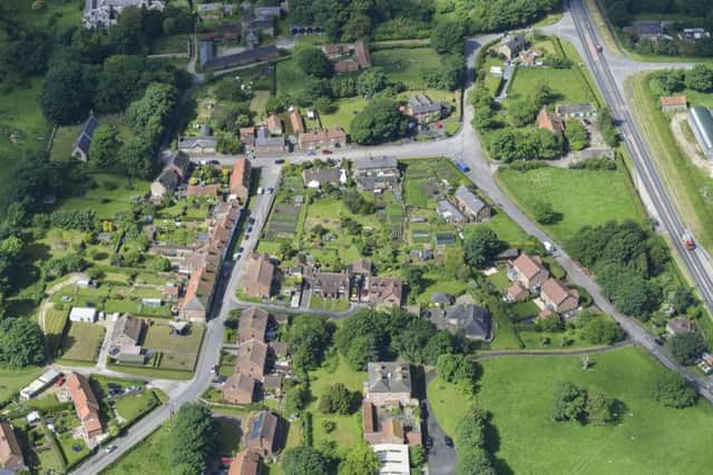 Undated handout photo issued by Cundalls of West Heslerton Hall (top left) and West Heslerton village as part of a sale for the West Heslerton Estate, Malton, North Yorkshire with an estimate of Â£20 million, including its 21-bedroom mansion, 43 houses, a pub, a range of other buildings and more than 2,000 acres of farmland. PRESS ASSOCIATION Photo. Issue date: Monday April 4, 2016. See PA story SALE Village. Photo credit should read: Cundalls /PA WireNOTE TO EDITORS: This handout photo may only be used in for editorial reporting purposes for the contemporaneous illustration of events, things or the people in the image or facts mentioned in the caption. Reuse of the picture may require further permission from the copyright holder.