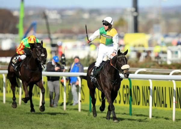 Jockey Leighton Aspell celebrates on board Many Clouds after victory in last year's Crabbie's Grand National.