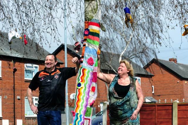 WOOLLY WONDER: Martin and Paula Rowling discovered their tree had been yarn bombed.