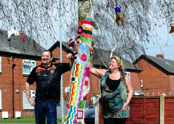 WOOLLY WONDER: Martin and Paula Rowling discovered their tree had been yarn bombed.