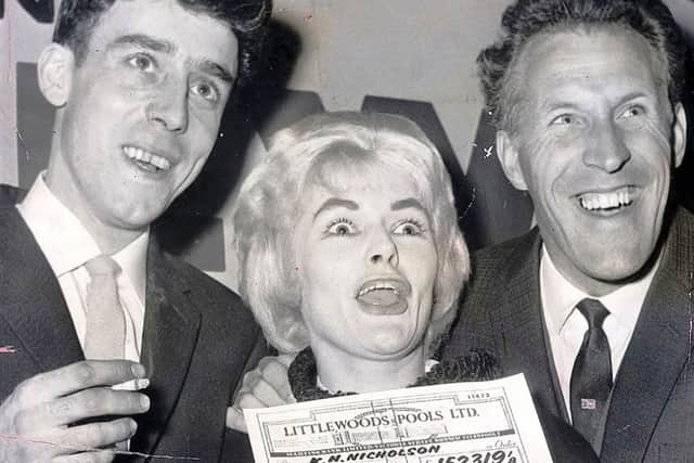 Viv Nicholson and husband Keith collect their Littlewoods pools cheque from Bruce Forsyth.