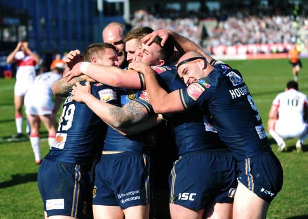 Hull FC's players celebrate Steve Michael's winning try in the derby.

Picture : Jonathan Gawthorpe