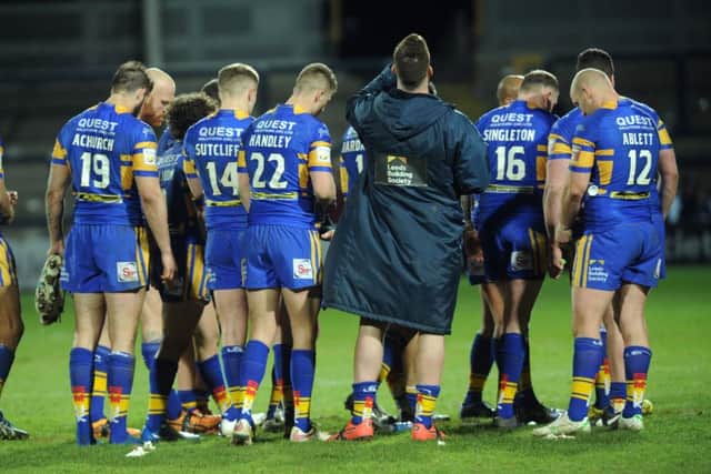 Leeds Rhinos' players at the end of their loss against Hull KR at Headingley.