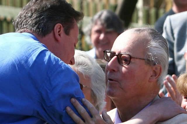 David Cameron greets his late father Ian at a campaign rally in 2010. Johnny Green/PA.