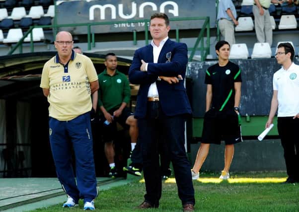 David Haigh chats to then-manager Brian McDermott in 2013.