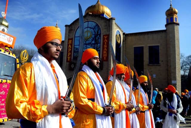 The Five Pure Ones, protecting the Sikh holy book during the procession at a previous Vaisakhi celebration in Leeds.