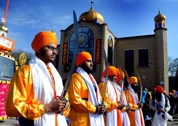The Five Pure Ones, protecting the Sikh holy book during the procession at a previous Vaisakhi celebration in Leeds.