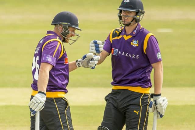 Yorkshire's Alex Lees, right, punches gloves with Andrew Gale, the man he has succeeded as the club's one-day captain. Picture: SWPIX.com
