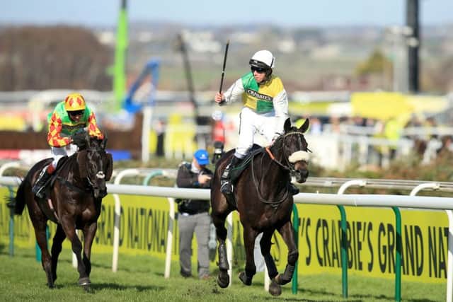 CATHC ME IF YOU CAN: Jockey Leighton Aspell celebrates on board Many Clouds after victory in the Crabbie's Grand National Chase at Aintree last year. Picture: Mike Egerton/PA Wire