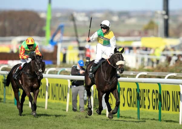 CATHC ME IF YOU CAN: Jockey Leighton Aspell celebrates on board Many Clouds after victory in the Crabbie's Grand National Chase at Aintree last year. Picture: Mike Egerton/PA Wire