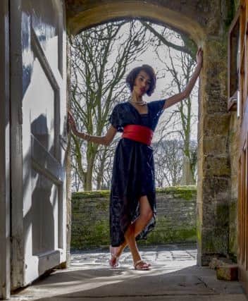 She, too, was attired in oriental fashion: a crimson scarf tied sash-like round the waistBlack kaftan, red sash, stylists own; beaded sandals, Â£36; bracelet, Â£8; set of two necklaces, Â£12.