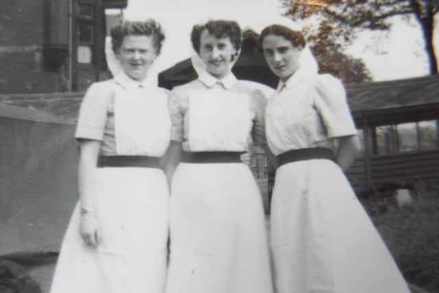 Enid Winkley (left) with colleagues outside the former nurses' home at St Jamess Hospital, Leeds