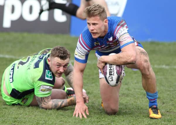Wakefield's Jacob Miller touching down the second of his three tries scored against Wigan. PIC: Andy May