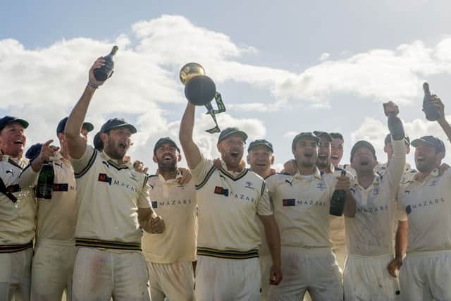 SAME AGAIN PLEASE: Yorkshire's captain Andrew Gale holds the LV County Championship trophy aloft as his team celebrates victory a second successive County Championship title at Headingley last September. Picture: SWPIX.COM