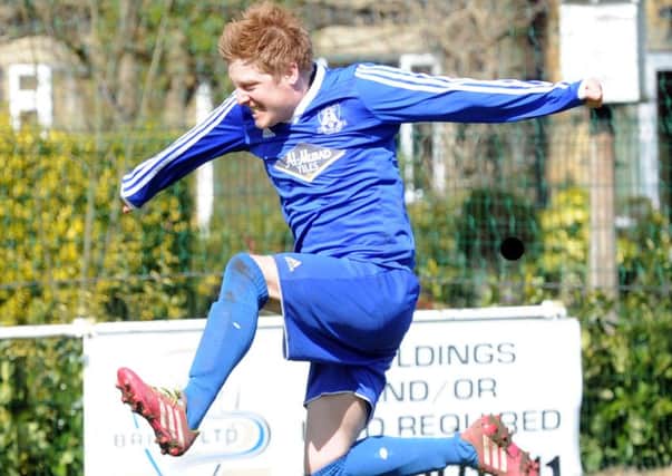 Leeds City Rovers' 
Nick Clarke is jumping for joy after netting a hat-trick in a 3-1 Sanford Cup semi-final win over Hope Inn Whites. PIC: Steve Riding