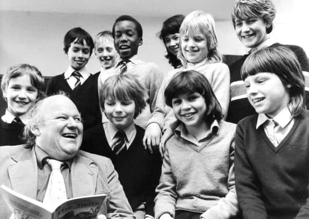 Leeds, Moortown, 12th April 1984

Comic actor Roy Kinnear turned to "The Twits" when he visited Allerton Grange Middle School, Moortown, Leeds.

The television and stage star, who is appearing this week at the Grand Theatre, Leeds, took tim eoff for a spot of story telling in the school hall and is pictured here with some of the second year pupils.