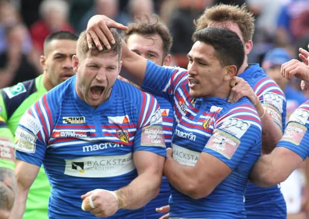 Nick Scruton celebrates Wakefield's opening try against Wigan.