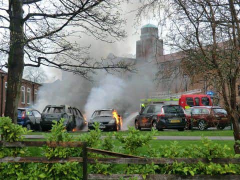 A car on fire in a church car park at the Immaculate Heart of Mary in Moortown, Leeds. Photo: Michael Crossley.