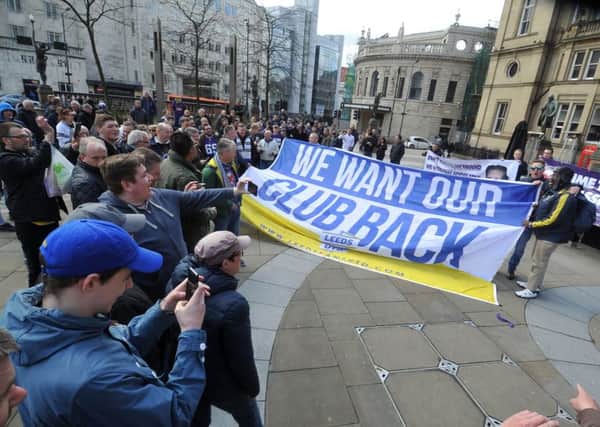 Leeds United fans gather at the start of a protest march in City Square before heading to Elland Road.  Pictures: Tony Johnson