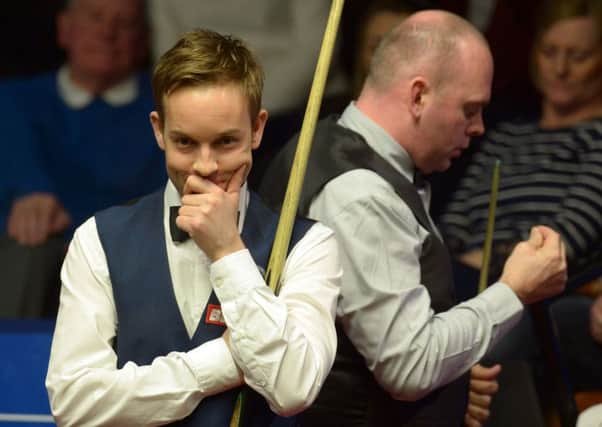 Ali Carter (left) and Stuart Bingham during day one of the Betfred Snooker World Championship.