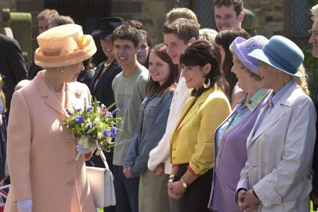 11 july 2002.
The Queen and Duke of Edinburgh's visit to Harewood House and the Emmerdale set today (thursday).
The Queen meets members of the Emmerdale cast during her visit to the Emmerdale set at Harewood.