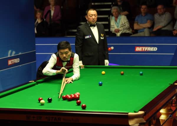 Ding Junhui in action against Martin Gould in Sheffield.