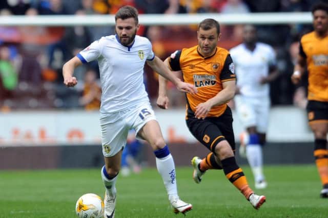 DERBY DATE: Leeds United's Stuart Dallas holds off Shaun Maloney. Picture: Simon Hulme.