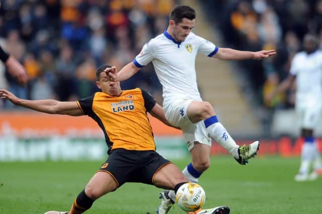 Leeds United's Lewis Cook is challenged by Jake Livermore. Picture by Simon Hulme