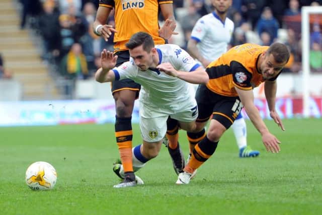 Lewis Cook is challenged by Shaun Maloney. Picture: Simon Hulme.