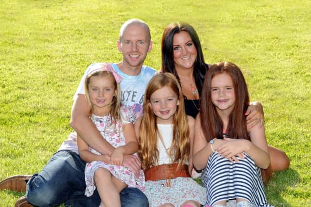 Mike and Sarah Lovell with their daughters Izzy, Amelia and Ella.