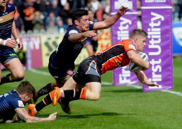 Castleford's Ryan Hampshire breaks through the Hull KR defence to score.