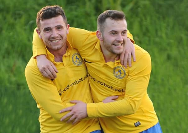 Aiden Gilligan , lef,t is congratulated by Jake Williams after scoring the third goal for Horsforth St Margaret's against Kippax Athletic in Division Three. 
Two goals from Karl Barker and one from Greg Rowell completed the 4-1 win on Monday.