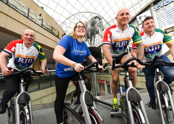 Ride to Rio cyclists Mike West, Keith Senior and Paul Highton with Holli Kellett at Leeds Trinity.