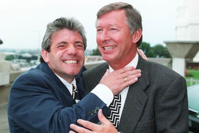 ALL IN THE PAST: Kevin Keegan (left) gets to grips with Manchester United boss Sir Alex Ferguson, some years after his outburst, live on TV. Picture:: Adam Butler/P.
