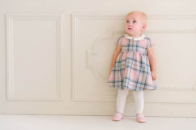 From Seraphine's own campaign shoot - Pink tartan woollen baby dress, Â£89.