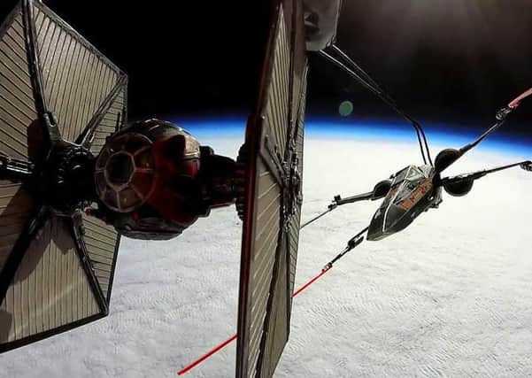 A pair of Star Wars nerds have sent this X-Wing and Tie Fighter to where no others have gone before - to dogfight in space.  See SWNS story SWFORCE: Pals Matt Kingsnorth and Phil St. Pier (corr) have made it their mission over the past 18 months to pitch a Millennium Falcon, X-Wing and Tie Fighter against each other. Using a helium balloon to launch the ships, in March Matt and Phil launched an X-Wing and Tie Fighter into space attaching cameras to the balloon to capture the moment. The pair, who have uploaded videos of their missions say they want to be extras in the next movie but have so far been "completely blanked" by JJ Abrams.