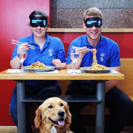 Sue Dorrington and Chris Senior with guide dog Yasmin.