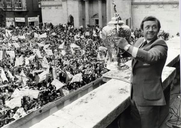 Hull KR captain and coach Roger Millward holds the Challenge Cup in 1980.