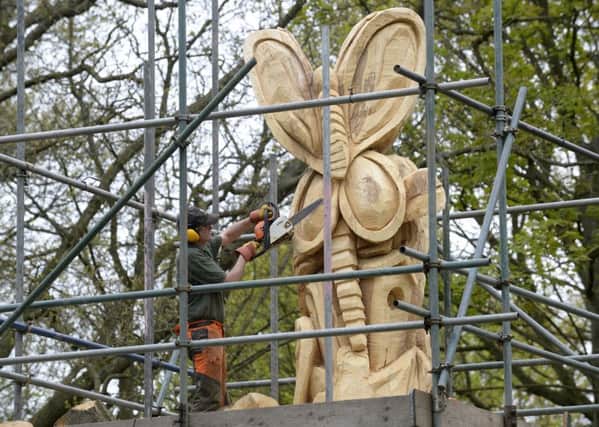 Local artist Shane Green working on his most recent sculpture in progress at Roundhay Park.