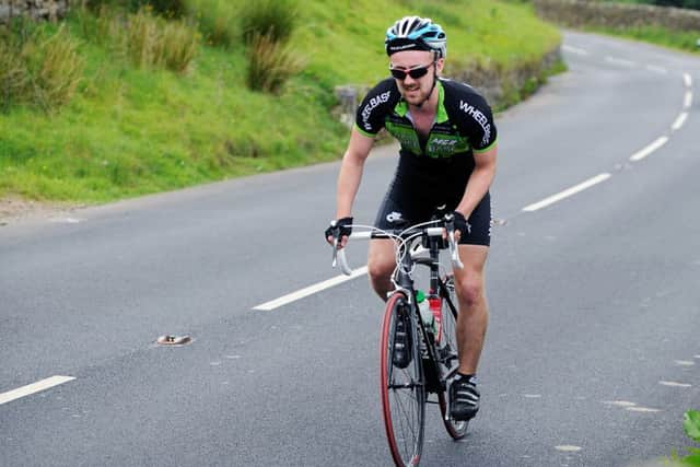 Reporter Jonathan Brown cycling up Buttertubs Pass in 2014. Picture by Jonathan Gawthorpe.