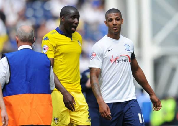 WHAT'S GOING ON? Leeds United captain Sol Bamba walks off with Preston's former Whites favourite Jermaine Beckford. Picture by Jonathan Gawthorpe.