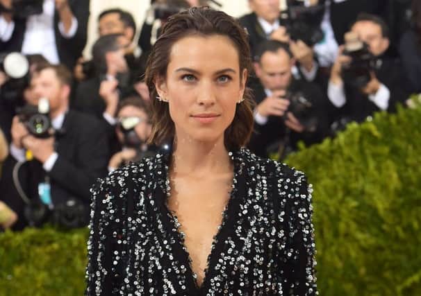 Barely there make-up with swept back hair for this glitzy mannish look when Alexa Chung arrives at The Metropolitan Museum of Art Costume Institute Benefit Gala, celebrating the opening of "Manus x Machina: Fashion in an Age of Technology" on Monday, May 2, 2016, in New York. (Photo by Charles Sykes/Invision/AP)