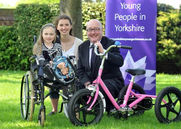 Peter McCormack  launches the 2016 Yorkshire Young Achievers Awards with 2015 Unsung Hero, Hannah Wilks, of Leeds, centre,  and six-year-old Baila Lester.