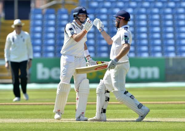 DYNAMIC DUO: Jonny Bairstow with Joe Root in action for
Yorkshire against Surrey earlier this week.  Picture: Bruce Rollinson