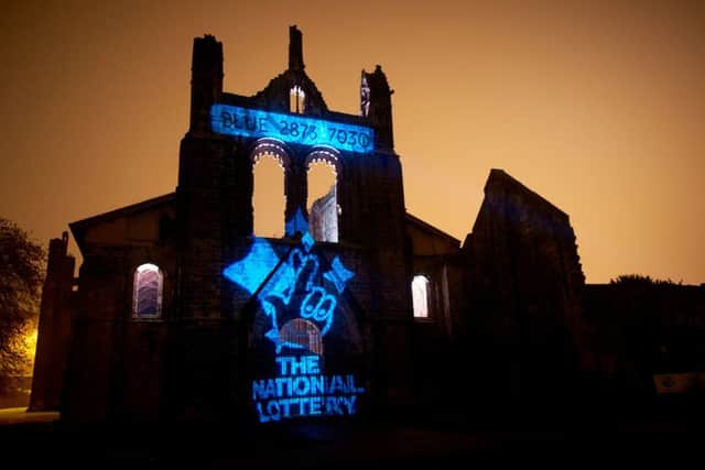Good Relations - Camelot.

Unclaimed winning lottery ticket projected onto Kirkstall Abbey. 3rd Nov 2015.