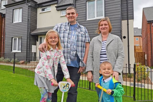 The family outside their new home on Bellways Parkside.
