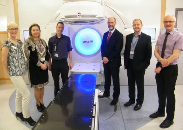 Experts with a radiotherapy machine at Leeds Cancer Centre.