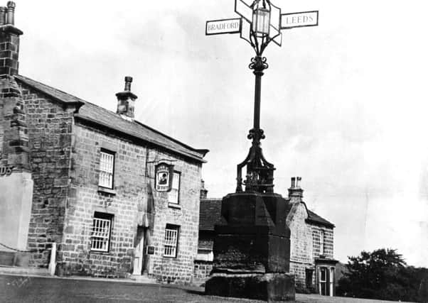 Bramhope June 1966

The combined street lamp and road sign above the old village cross base at Bramhope, near Leeds.

Fox and Hounds Public House.