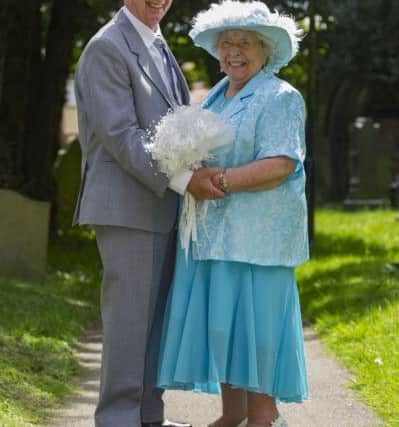 Sally, 82,  and Colin, 85, Dunn, marry at St Mary's Church Middleton, Leeds, after  44 years together. Pictures: James Hardisty