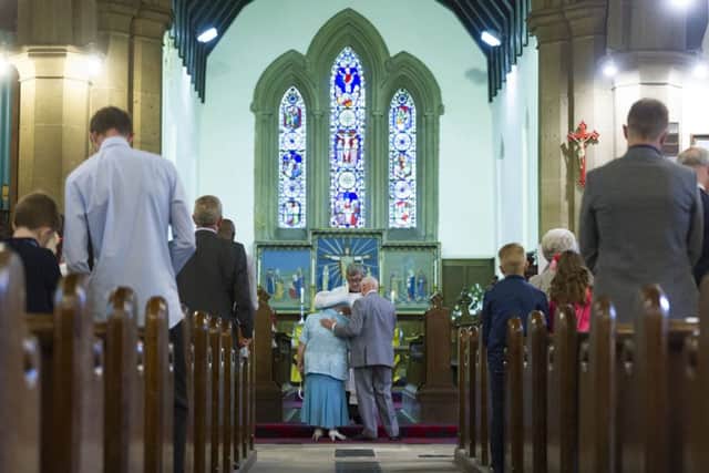 Sally, 82,  and Colin, 85, Dunn, marry at St Mary's Church Middleton, Leeds, after  44 years together. Pictures: James Hardisty